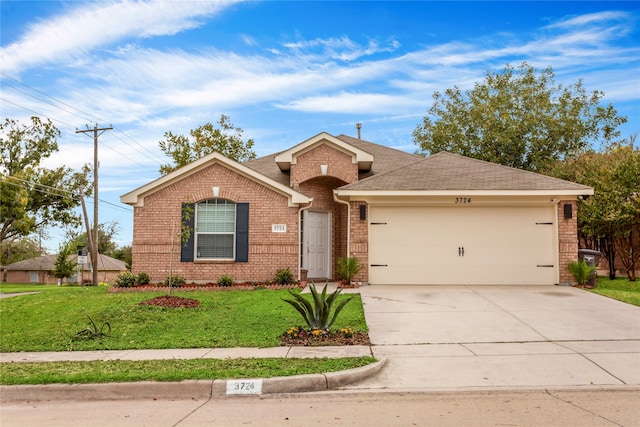 ranch-style home featuring a front yard and a garage