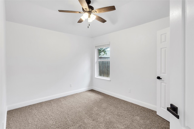 spare room with carpet floors and ceiling fan