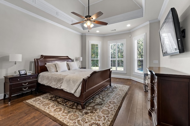 bedroom featuring ceiling fan, dark hardwood / wood-style flooring, and crown molding