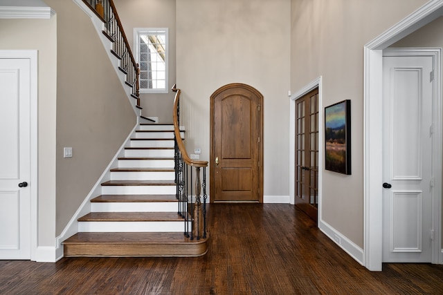 entrance foyer featuring dark hardwood / wood-style floors and ornamental molding