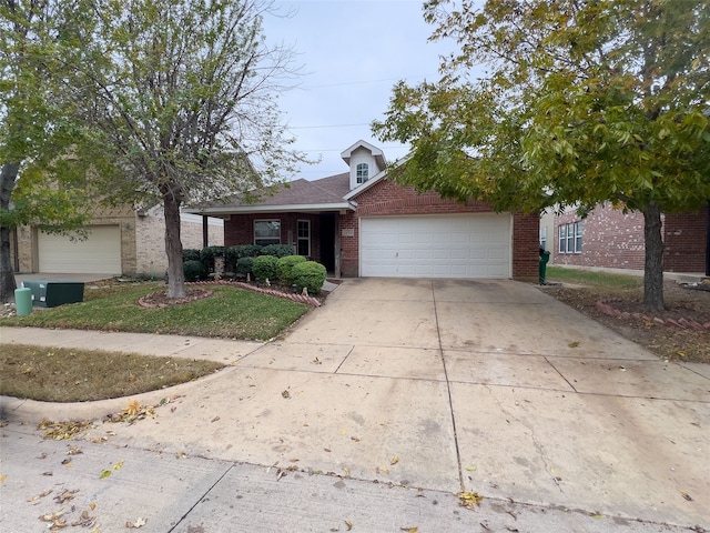 view of front facade featuring a front yard and a garage