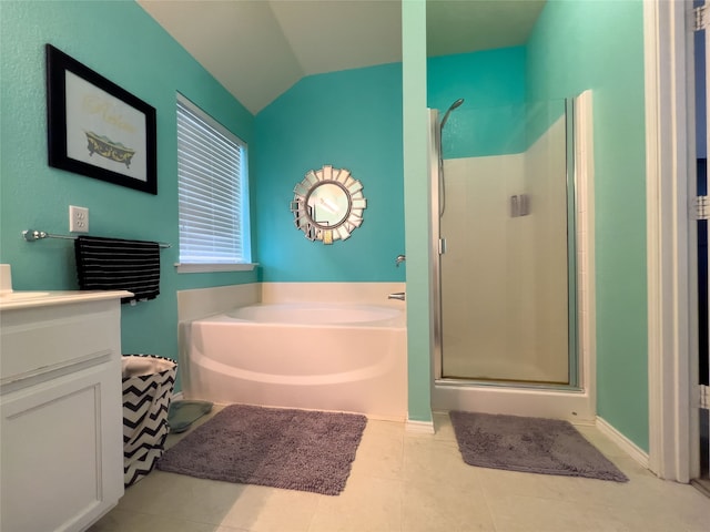 bathroom featuring separate shower and tub, tile patterned floors, vanity, and vaulted ceiling