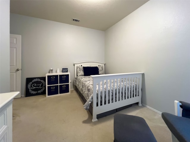 bedroom with light carpet