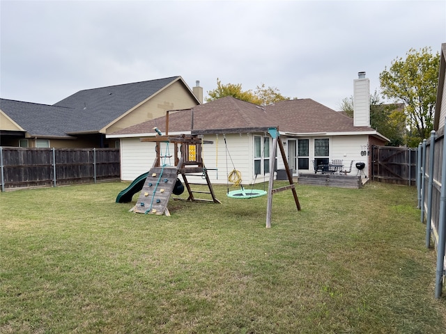 back of house featuring a yard and a patio