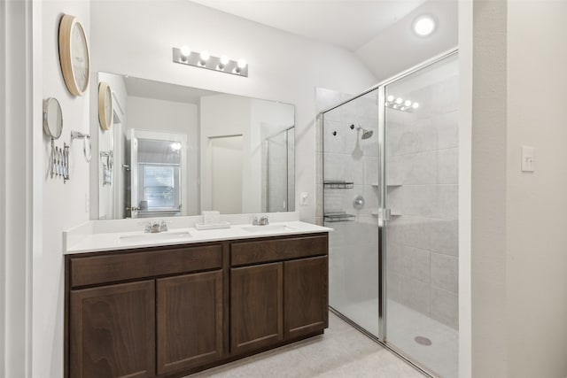 bathroom with vanity and a shower with shower door