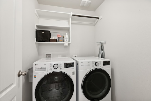 laundry area with washing machine and dryer