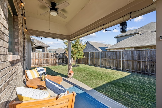 view of yard featuring ceiling fan