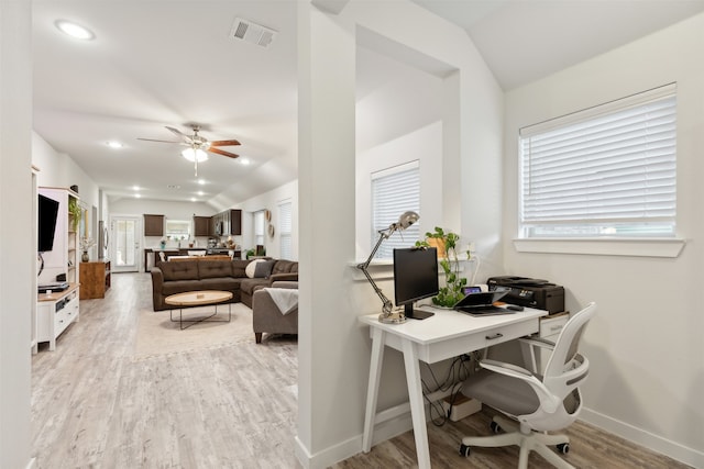 office area with ceiling fan, vaulted ceiling, and light wood-type flooring