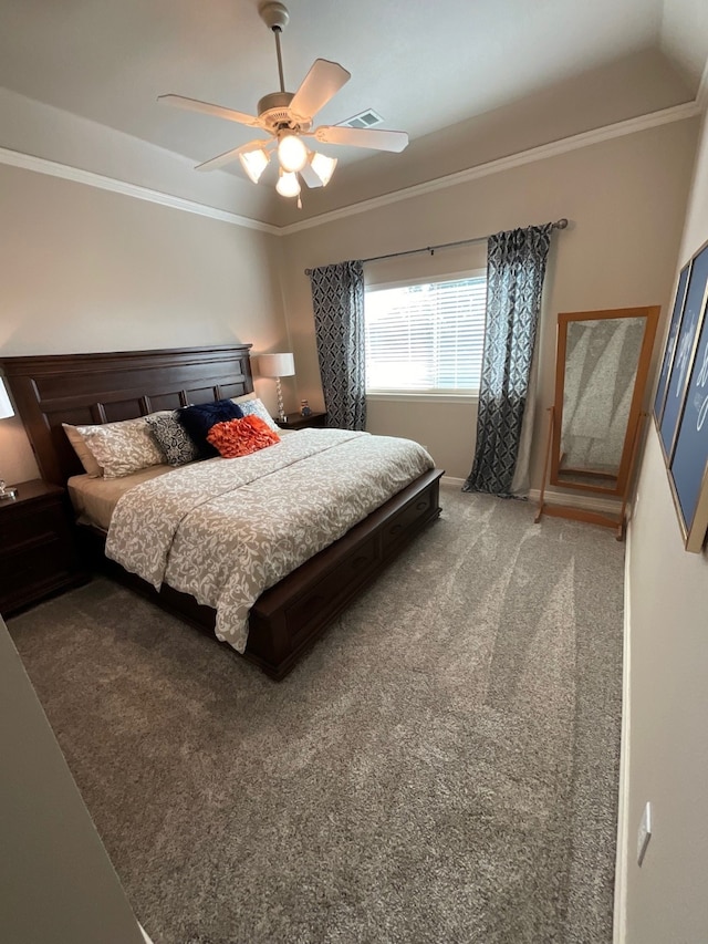 bedroom with carpet floors, ceiling fan, and crown molding