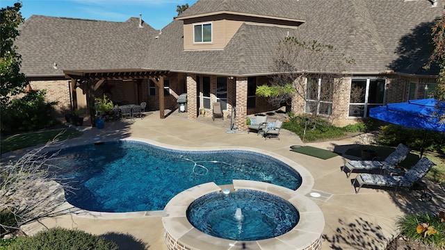 view of pool with a pergola, a patio area, and an in ground hot tub