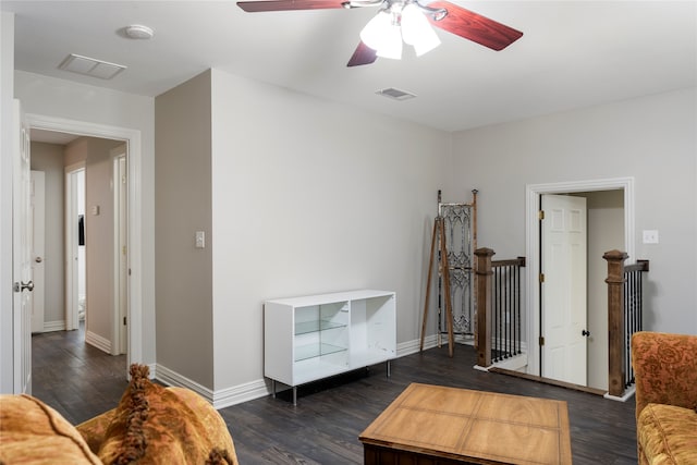 interior space with ceiling fan and dark wood-type flooring