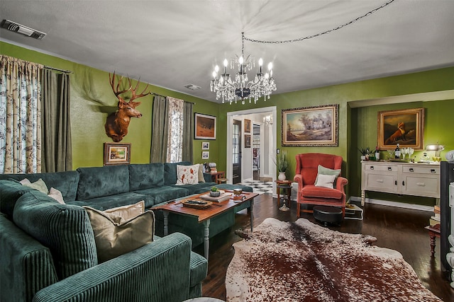 living room featuring dark hardwood / wood-style floors and a chandelier