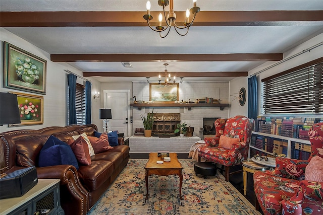 living room with beam ceiling, a textured ceiling, a fireplace, and a chandelier