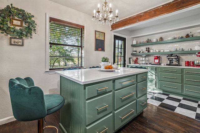 bar with green cabinetry, dark hardwood / wood-style floors, hanging light fixtures, and backsplash