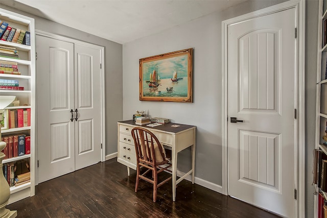 home office with dark hardwood / wood-style floors