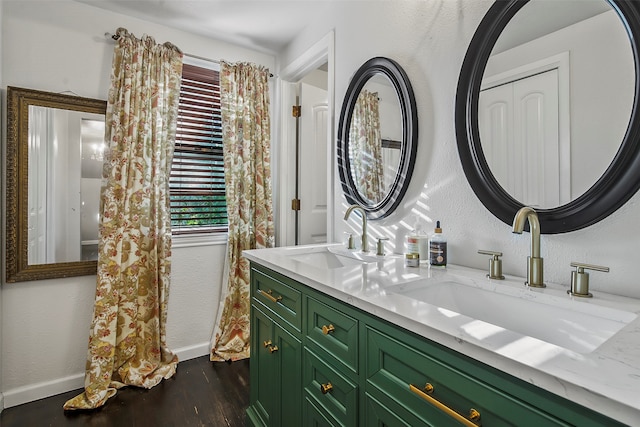 bathroom featuring wood-type flooring and vanity