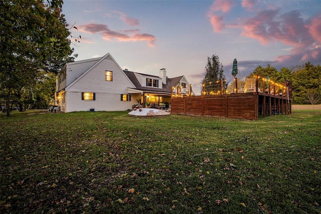 yard at dusk with a patio