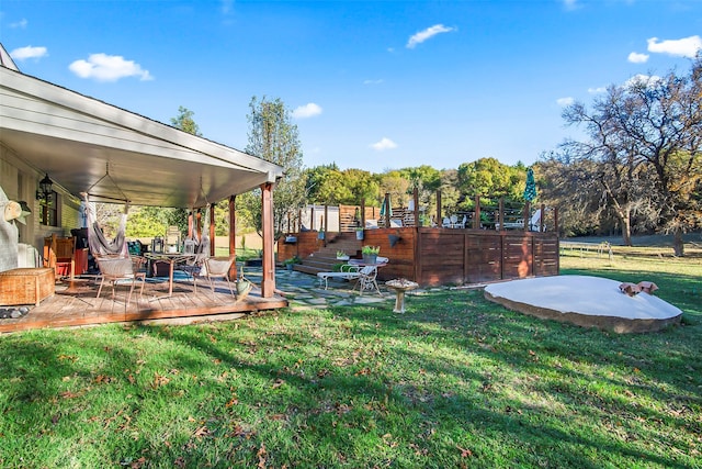 view of yard featuring a wooden deck