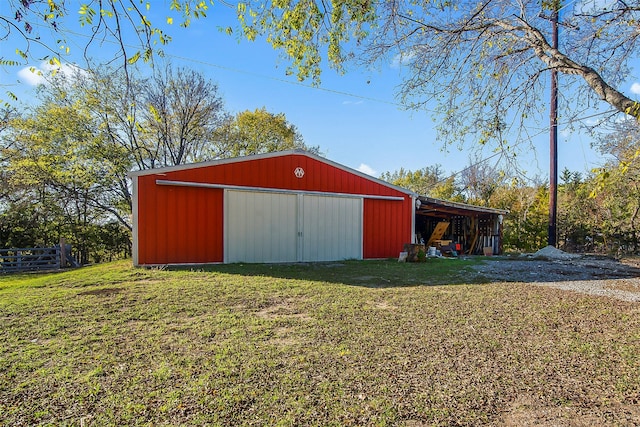 view of outbuilding with a yard