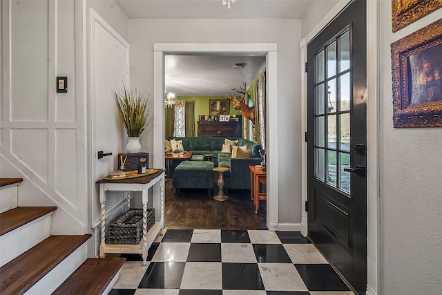 entryway featuring a notable chandelier