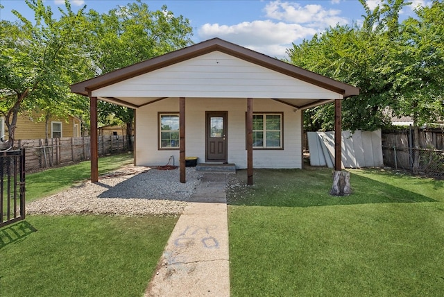 bungalow-style house with covered porch and a front yard