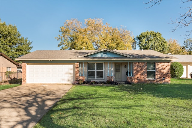 ranch-style home featuring a garage and a front lawn