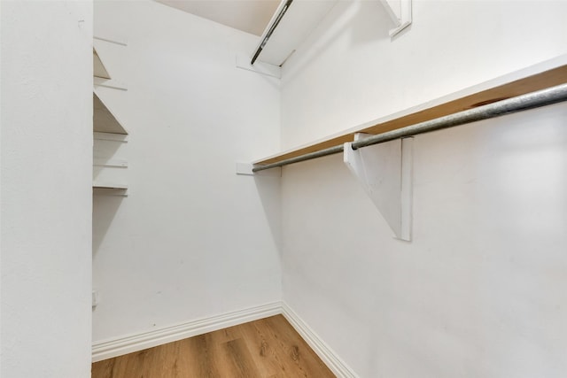 7421 Christopher Ct, North Richland Hills, TX 76180 - walk in closet with wood finished floors