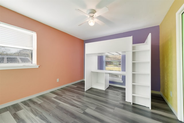 bedroom with ceiling fan and wood-type flooring