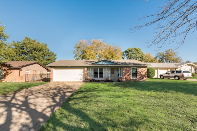 single story home featuring a garage and a front yard