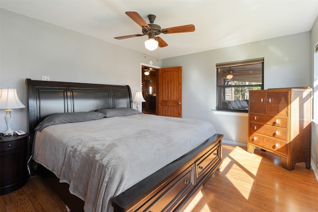 bedroom featuring hardwood / wood-style flooring and ceiling fan