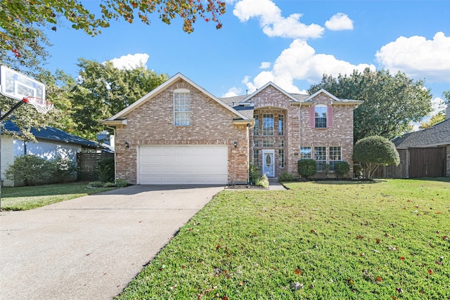 view of front property featuring a front lawn and a garage