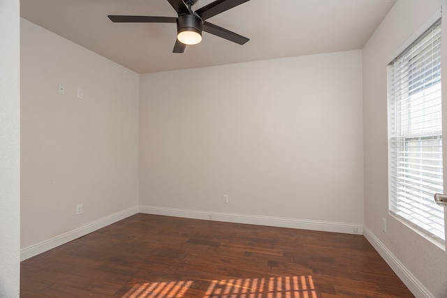 unfurnished room featuring ceiling fan and dark hardwood / wood-style flooring