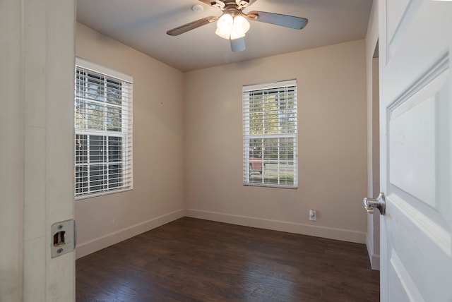 empty room featuring dark hardwood / wood-style floors and ceiling fan