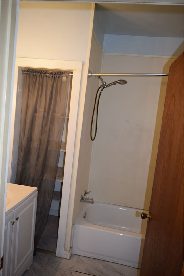 bathroom featuring vanity and shower / bath combination with curtain