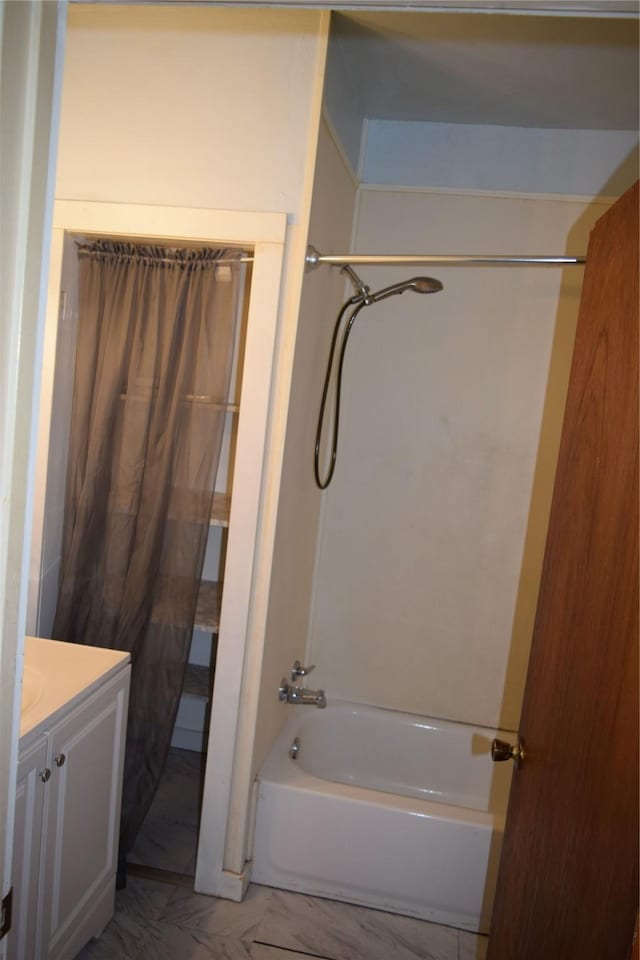 bathroom with vanity and washtub / shower combination