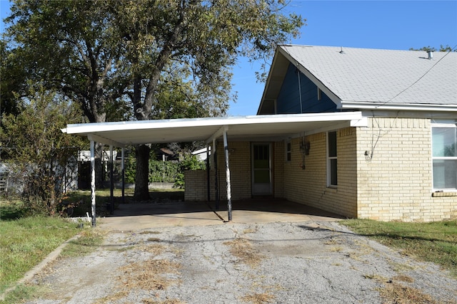 view of parking / parking lot featuring a carport