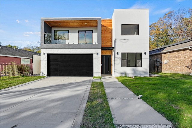 modern home with a front yard and a garage