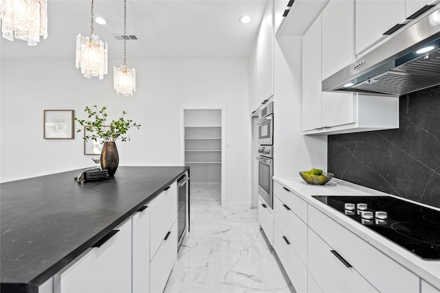 kitchen with pendant lighting, white cabinetry, tasteful backsplash, wine cooler, and white electric cooktop