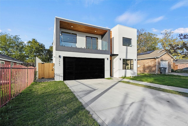 contemporary house with a front lawn and a garage