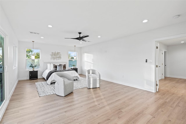 bedroom featuring ceiling fan and light hardwood / wood-style flooring