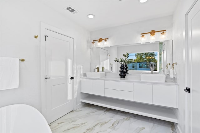 bathroom with vanity and a washtub