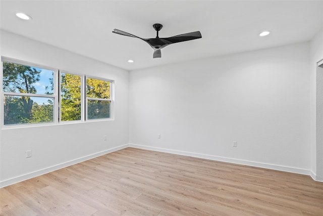 spare room with ceiling fan and light hardwood / wood-style floors