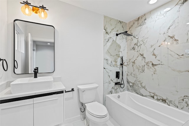 full bathroom featuring vanity, toilet, and tiled shower / bath