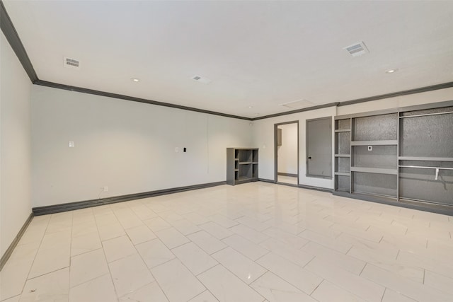 empty room featuring crown molding