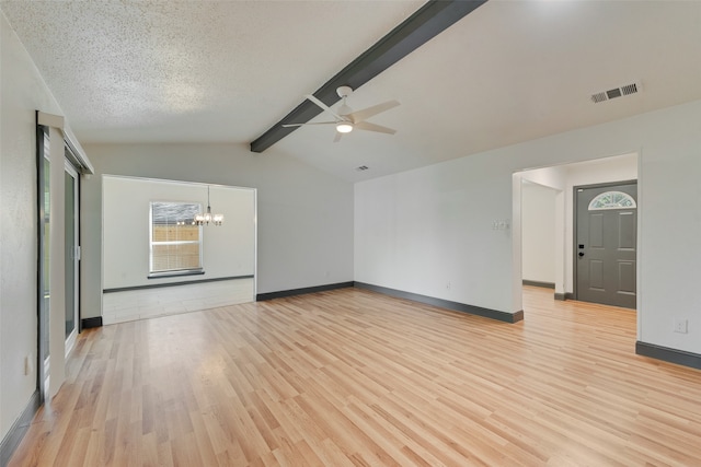 unfurnished room featuring vaulted ceiling with beams, ceiling fan with notable chandelier, light hardwood / wood-style floors, and a textured ceiling