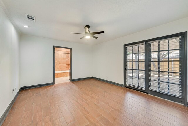 unfurnished room with ceiling fan and light hardwood / wood-style flooring