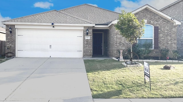 single story home with a garage and a front lawn