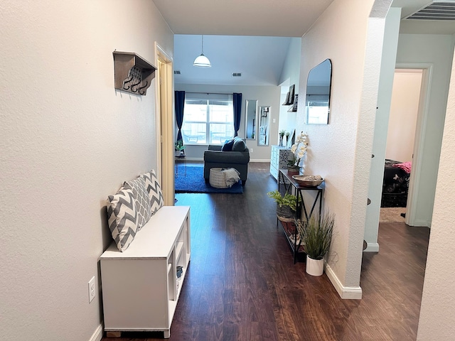 hall with dark wood-type flooring