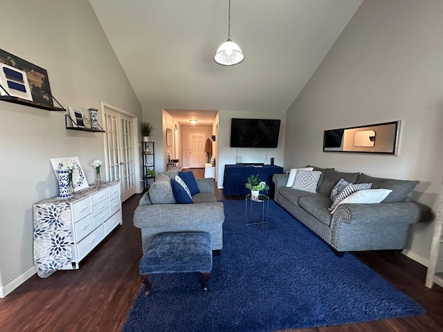 living room featuring dark hardwood / wood-style floors, high vaulted ceiling, and french doors