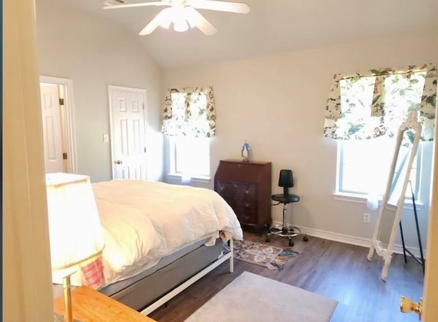 bedroom featuring lofted ceiling, dark hardwood / wood-style floors, and ceiling fan